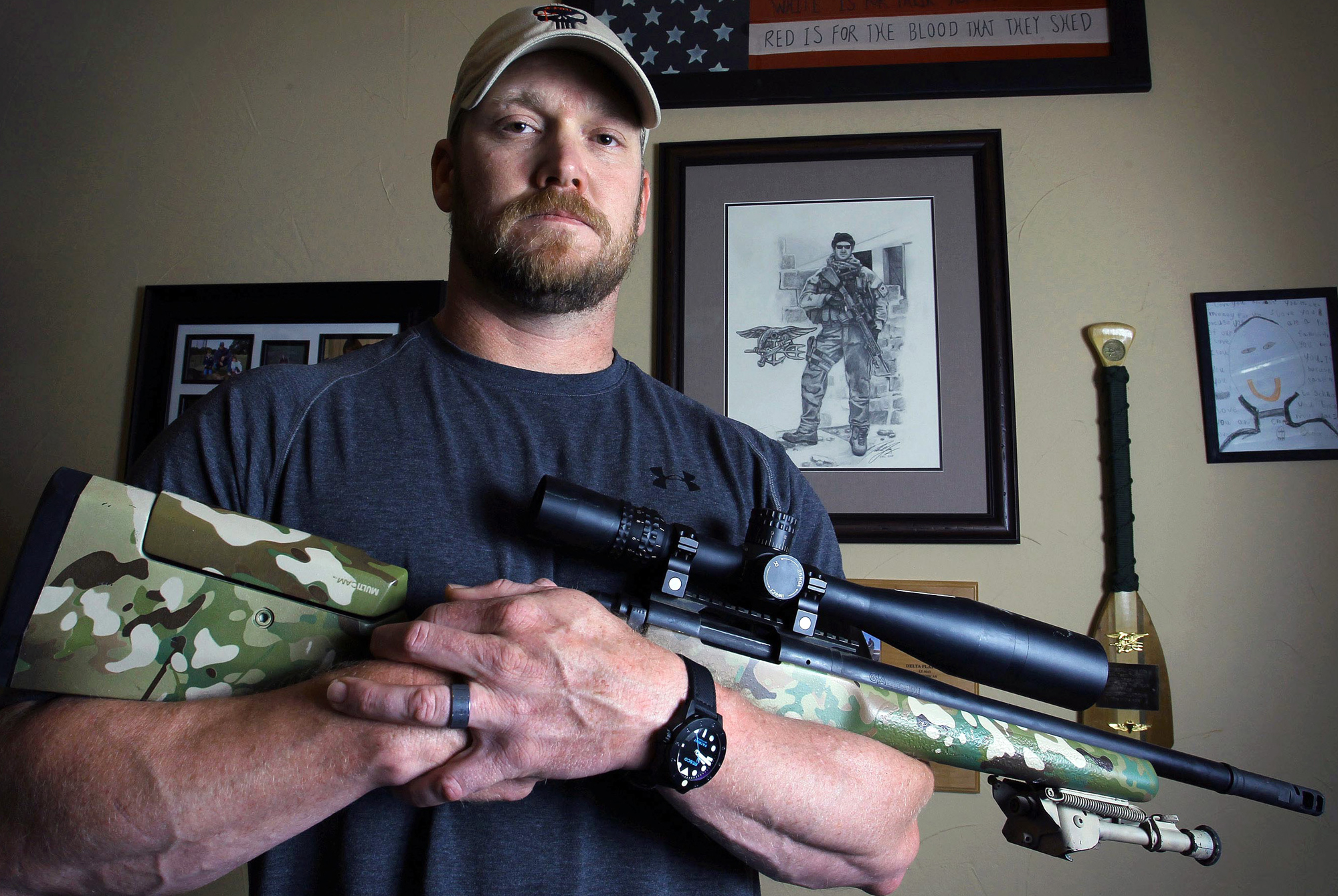 In this April 6, 2012, photo, former Navy SEAL and author of the book American Sniper, Chris Kyle poses in Midlothian, Texas. A Texas sheriff has told local newspapers that Kyle has been fatally shot along with another man on a gun range, Saturday, Feb. 2, 2013. (AP Photo/The Fort Worth Star-Telegram, Paul Moseley)